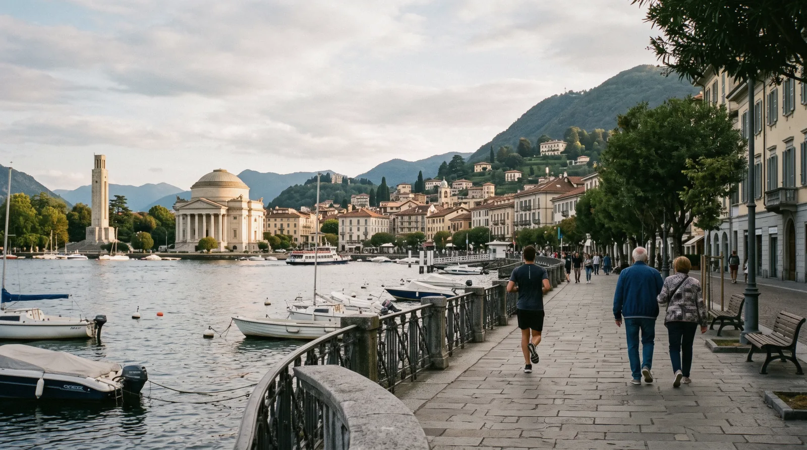The Como lakefront at Piazza Cavour with the ferry piers and the first basin of Lake Como in Como, Italy