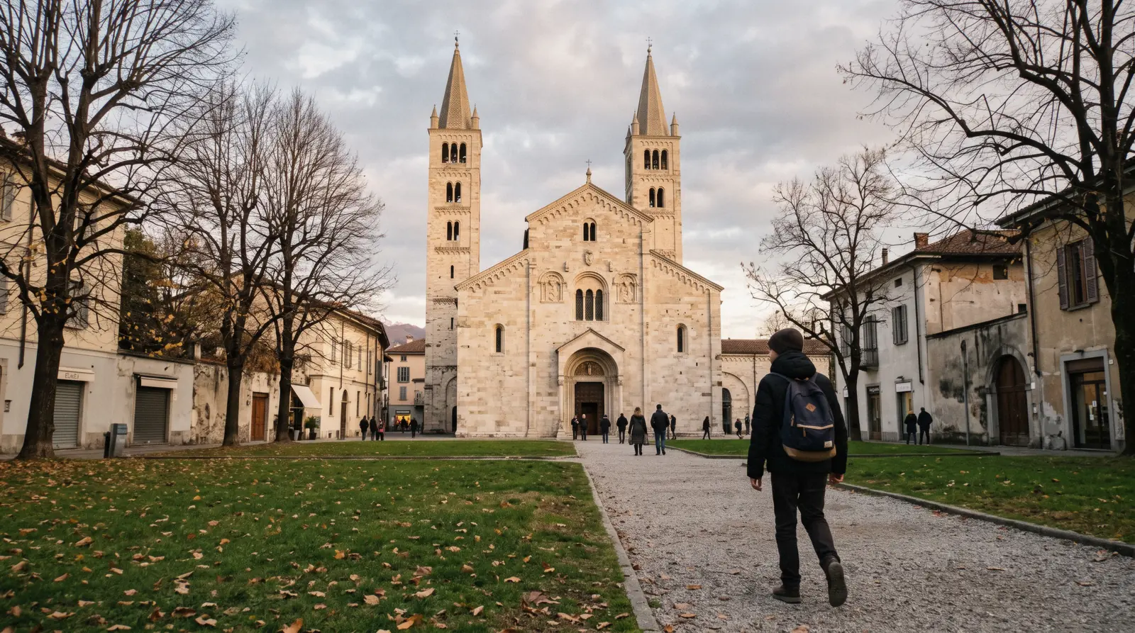 The twin Romanesque bell towers and stone façade of the Basilica di Sant'Abbondio, the basilica di sant abbondio in Como, Italy