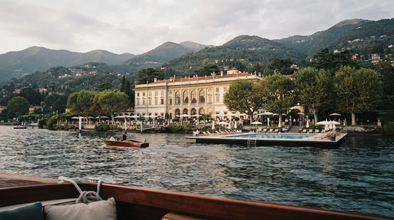 Villa d'Este on Lake Como seen from the water, its gardens and façade rising above the shore in Cernobbio near Como